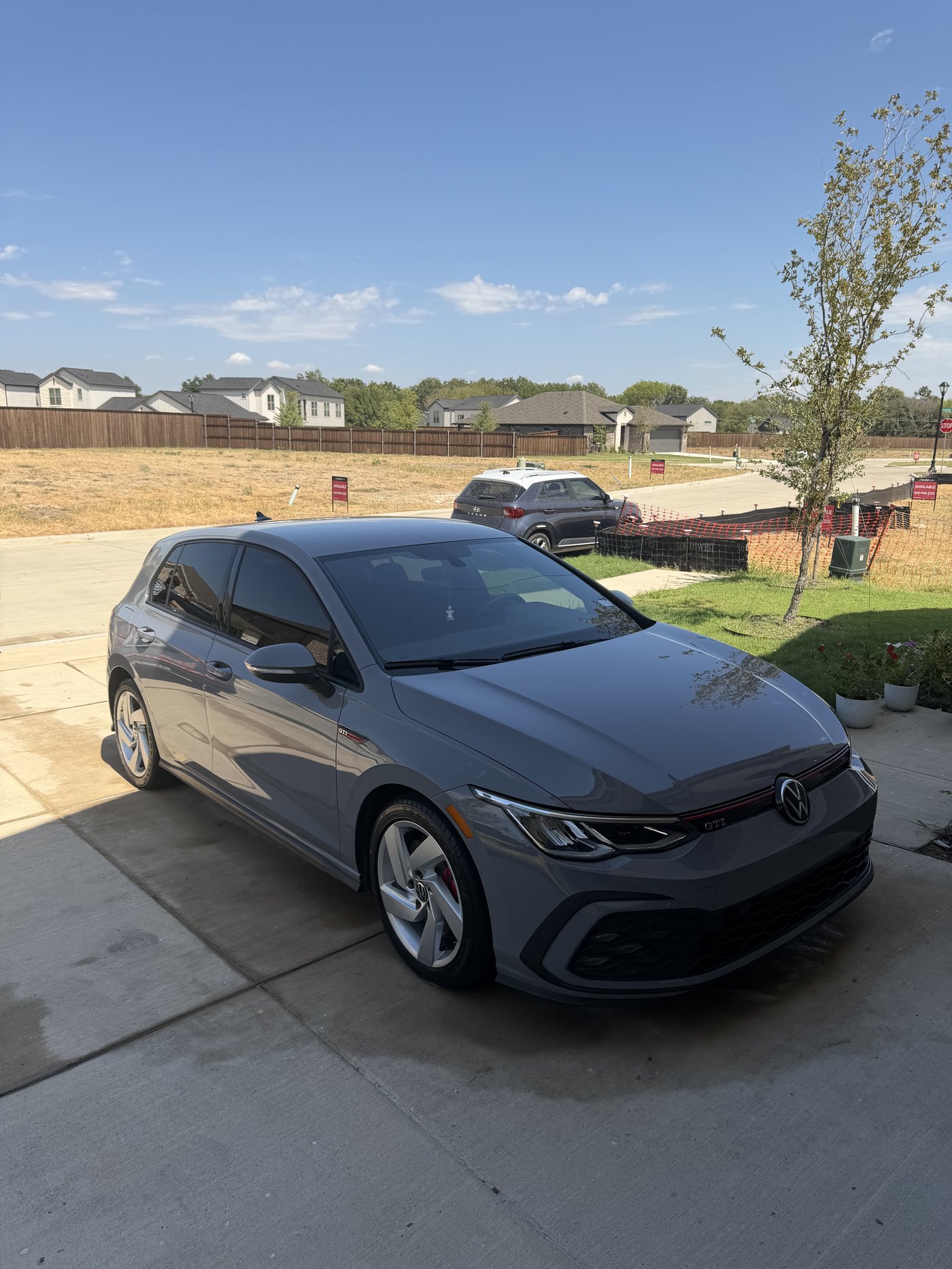Gray Volkswagen Golf GTI with a clean, debadged finish