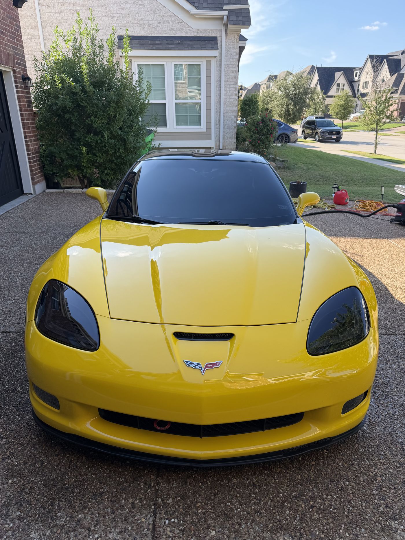 Yellow Chevrolet Corvette with a corrected, high-gloss finish
